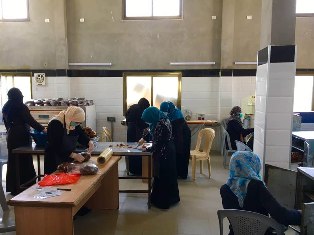 Women processing dates for sale in Gaza